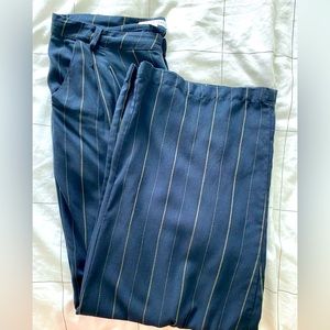 Brand new never worn pinstriped black wide leg pants. Very stylish.